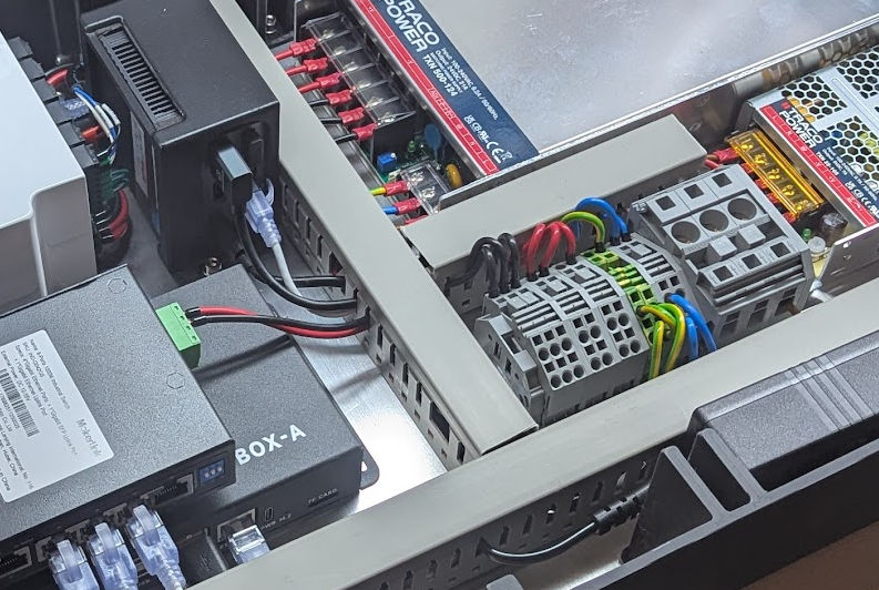 Automated motor production: machine control cabinet for stator winding.